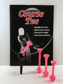 A pink and black golf tee sitting on top of a book.