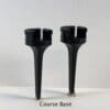 A pair of black plastic cups sitting on top of each other.