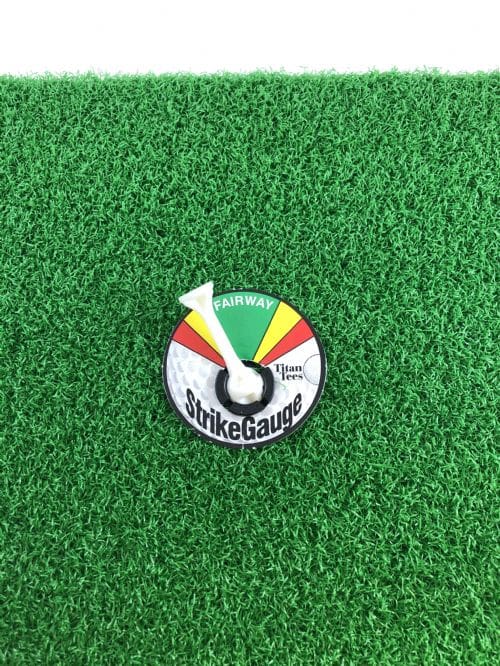 A pin on the ground with a green, yellow and red stripe.