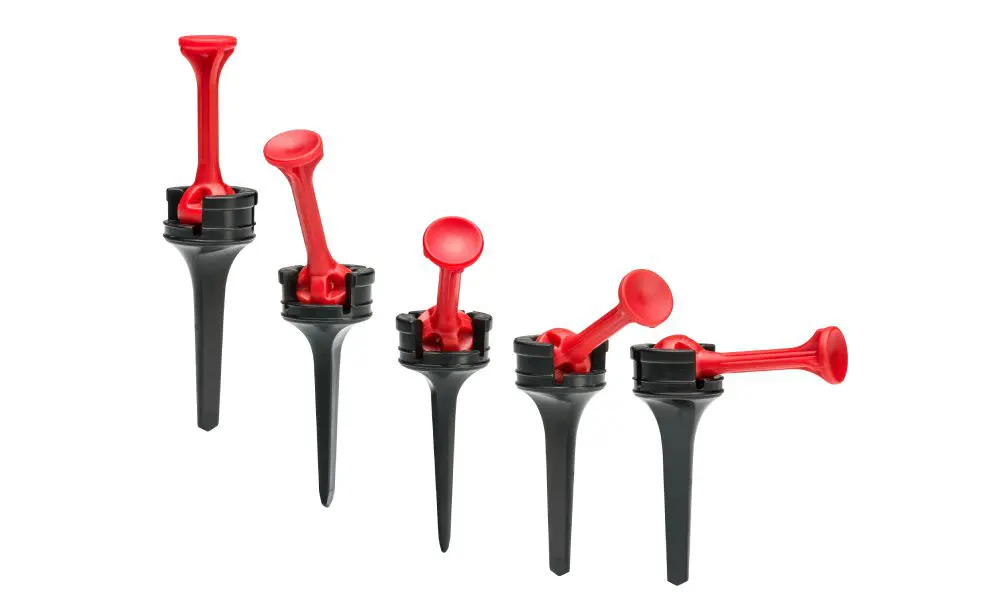 A set of six red and black plastic handles.