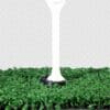A white pole sitting on top of green grass.