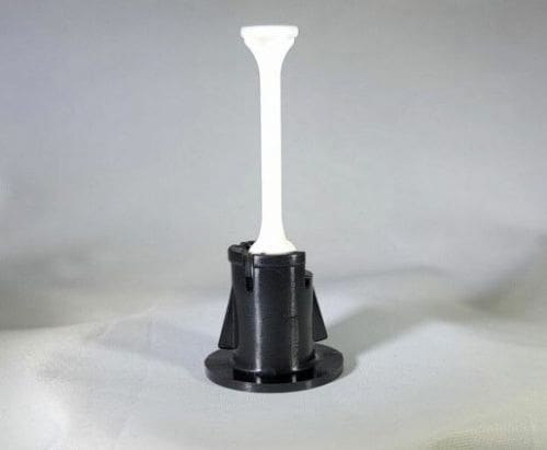A black and white plastic object sitting on top of a table.