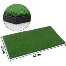 A green mat with grass on top of it.